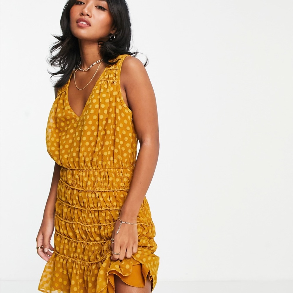 ASOS Petite soft sleeveless mini dress with textured ruched skirt in mustard